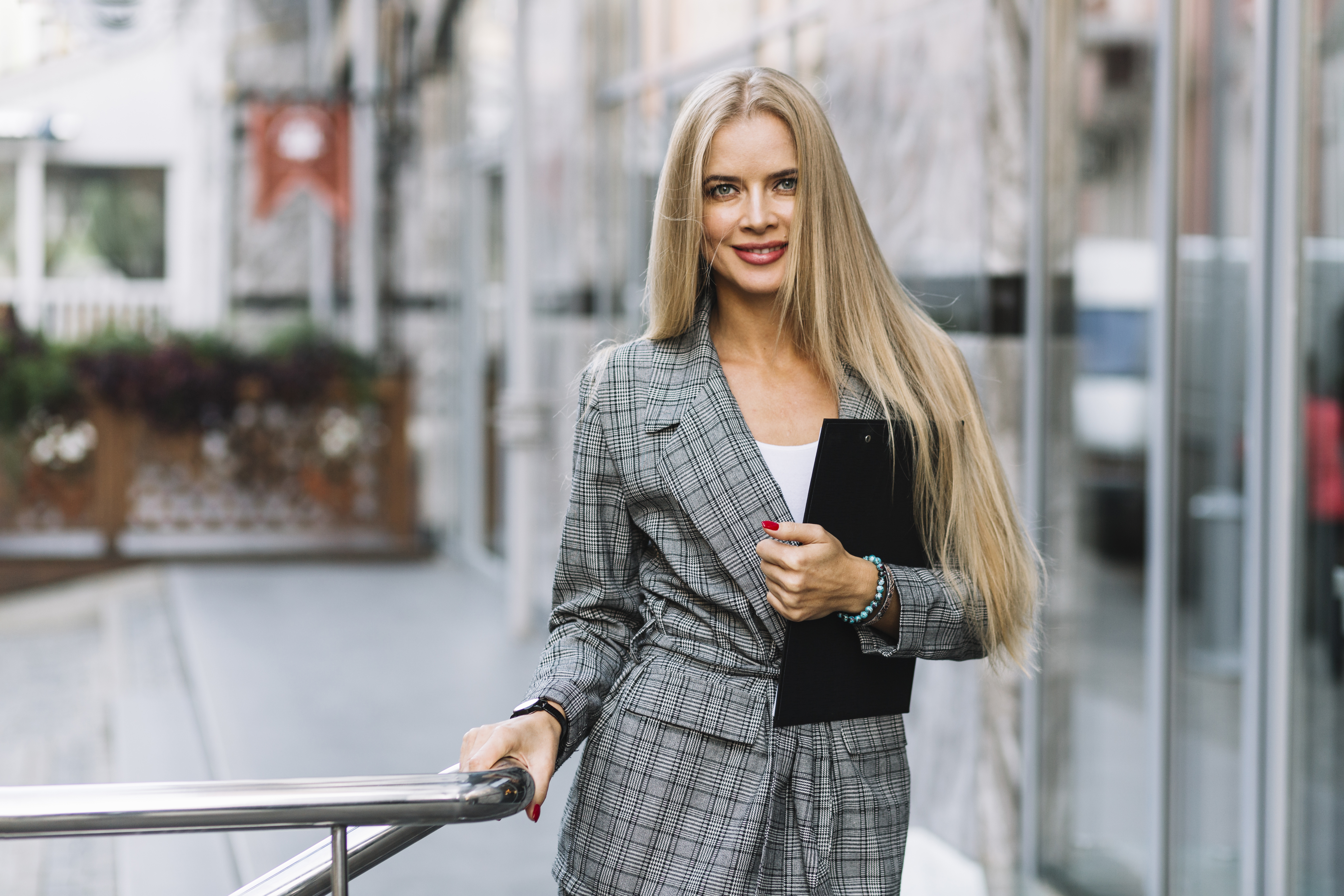 stylish-businesswoman-with-clipboard-city.jpg