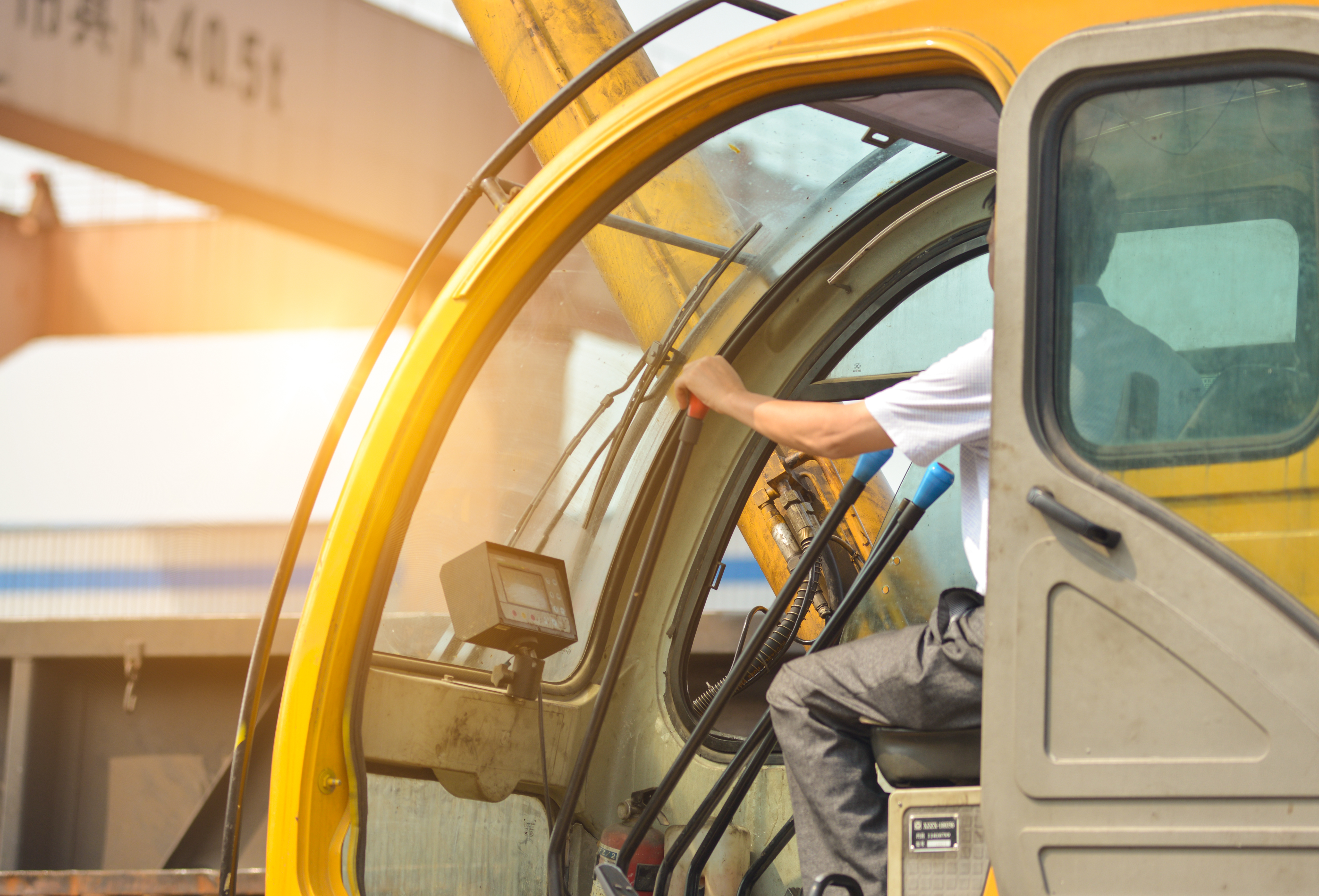 man-driving-crane-lift-up-some-equipments.jpg man-driving-crane-lift-up-some-equipments.jpg