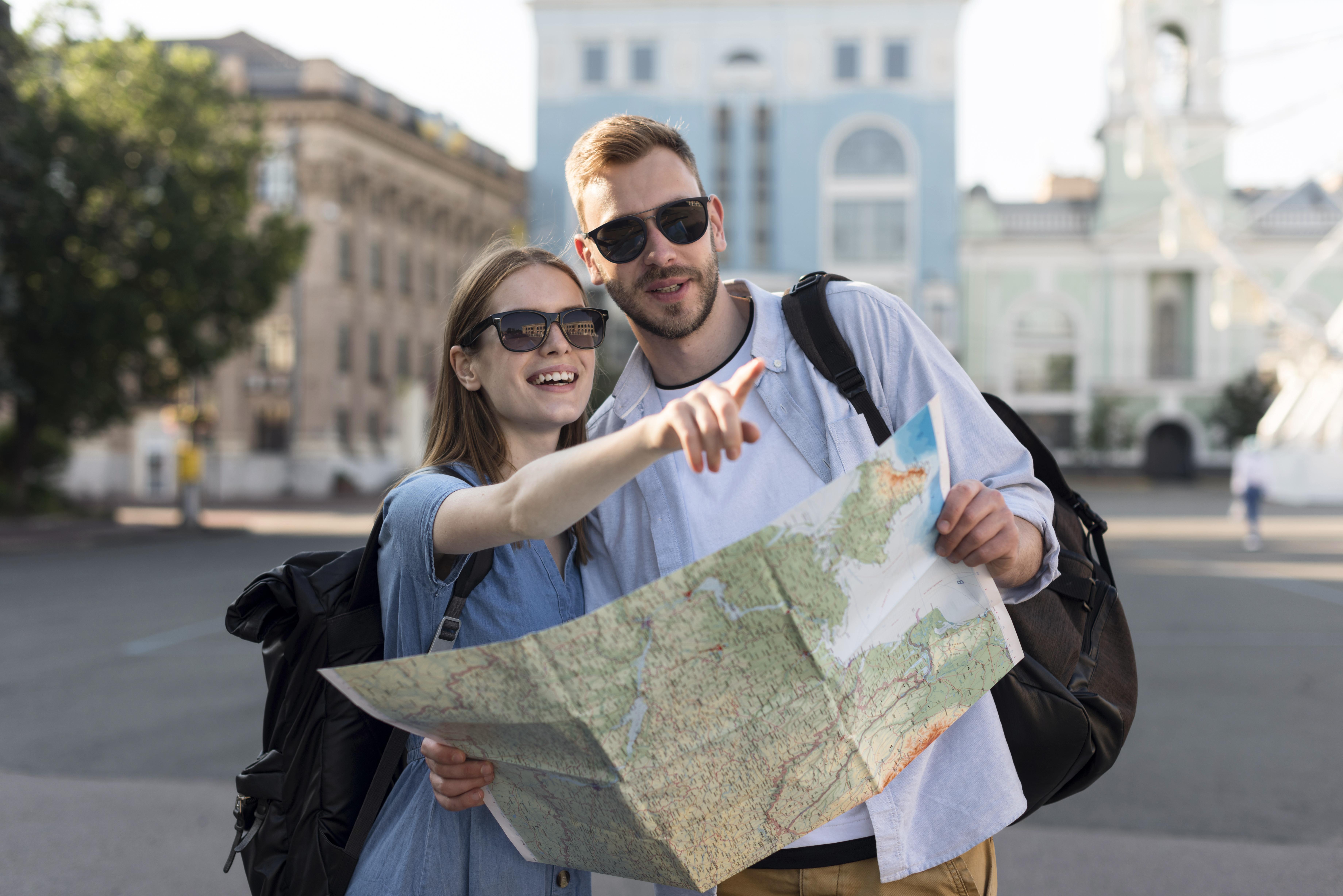 front-view-tourist-couple-pointing-something-while-holding-map.jpg front-view-tourist-couple-pointing-something-while-holding-map.jpg
