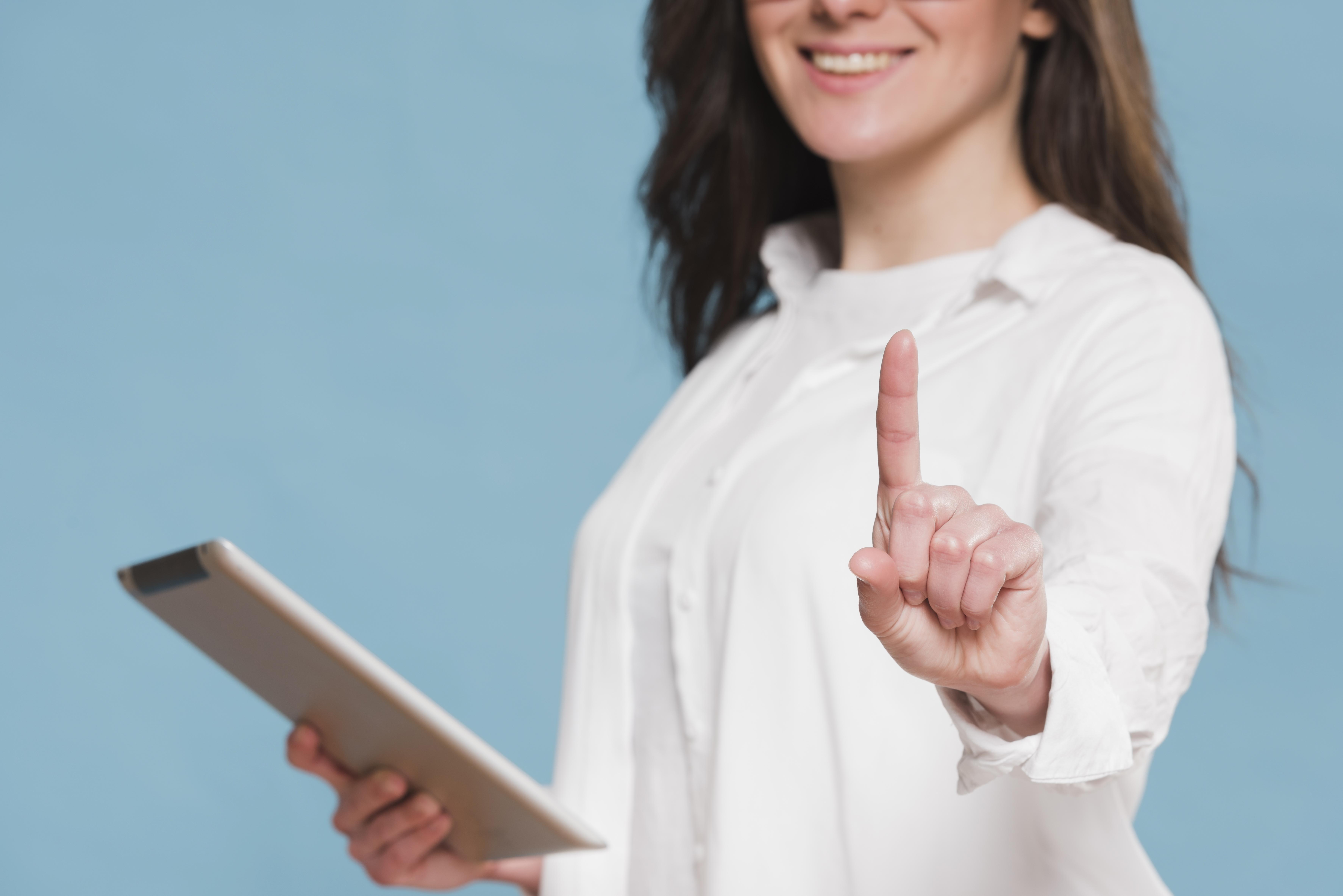 smiley-woman-holding-digital-tablet.jpg