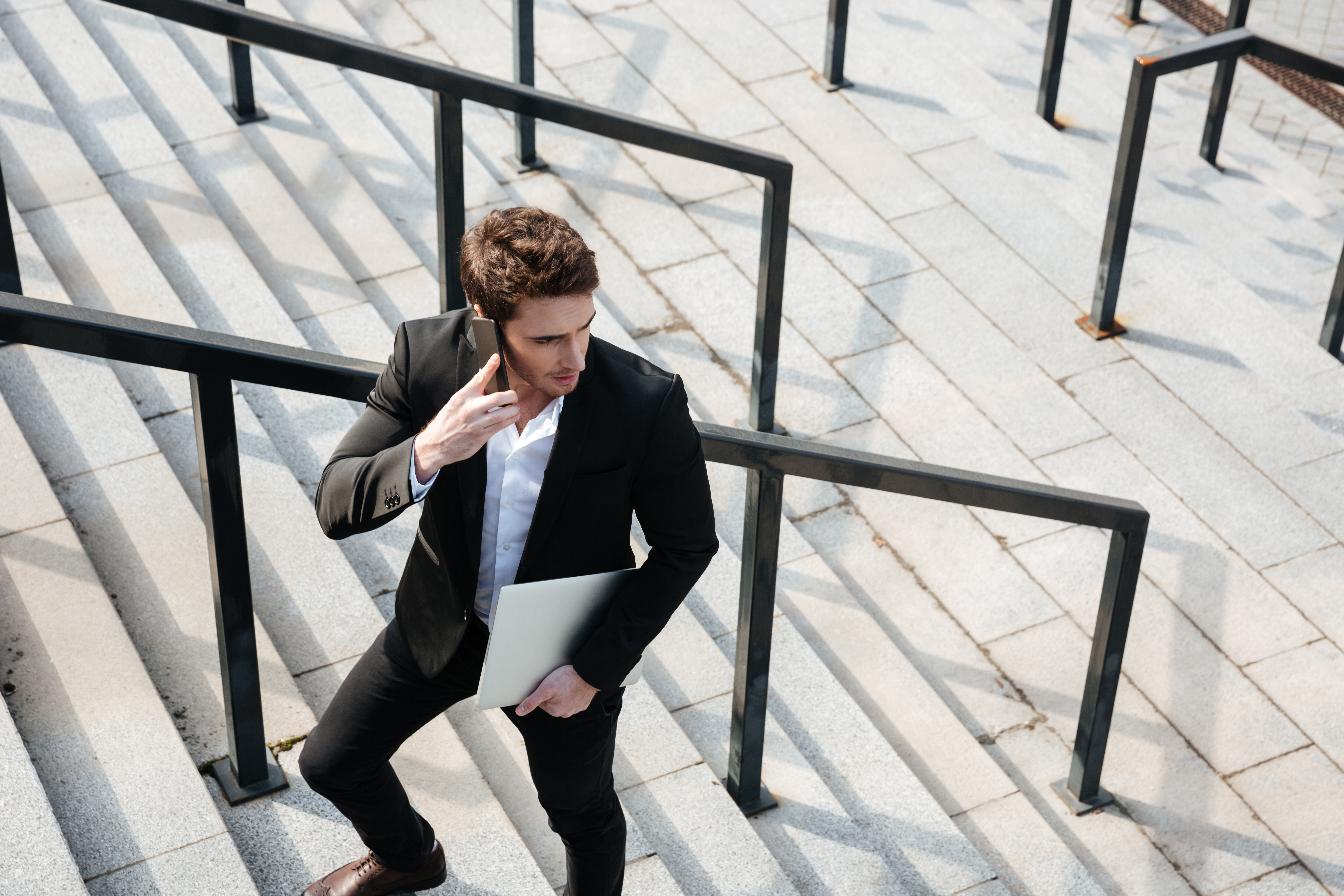 happy-young-businessman-walking-outdoors.jpg happy-young-businessman-walking-outdoors.jpg