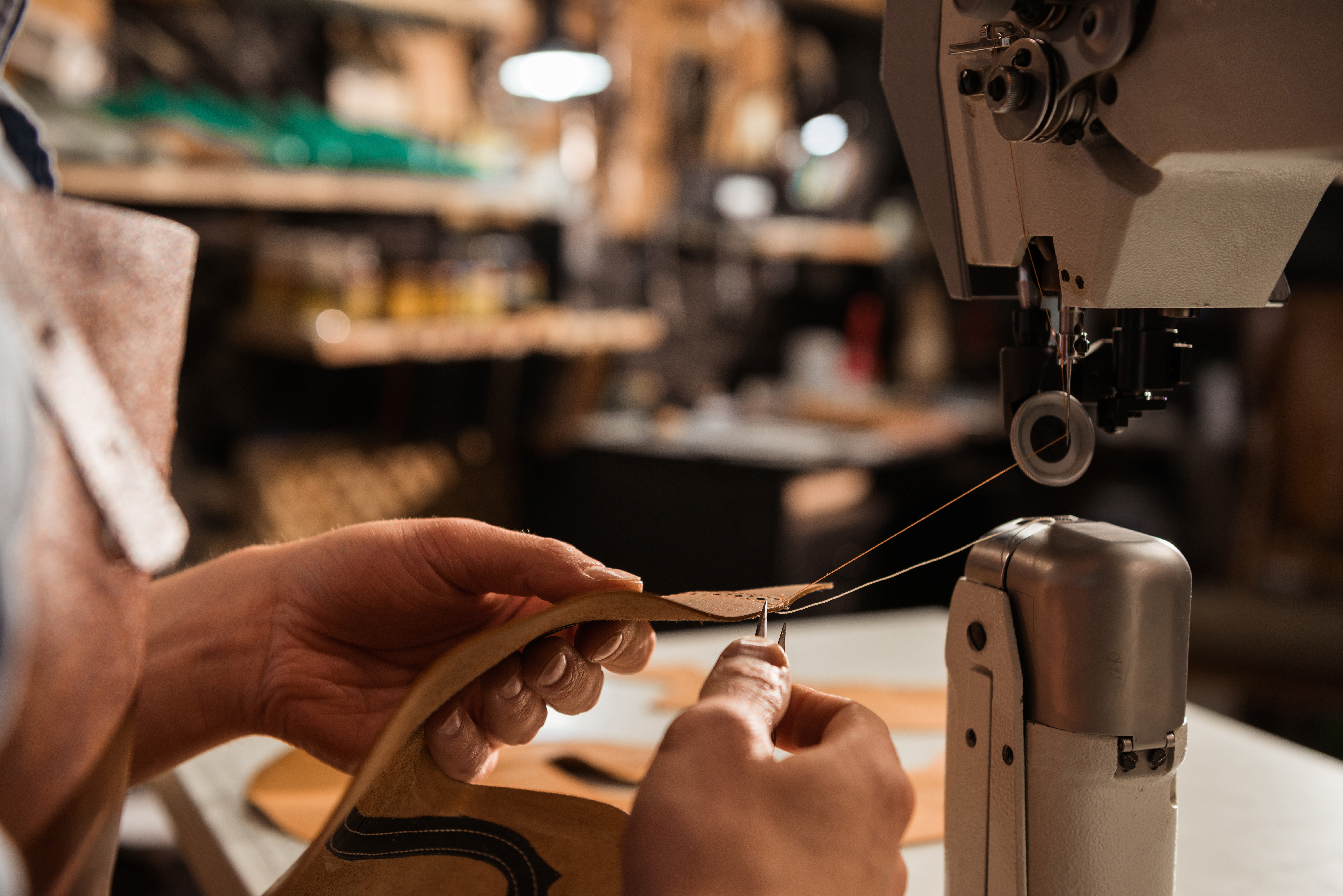 close-up-shoemaker-using-sewing-machine.jpg close-up-shoemaker-using-sewing-machine.jpg