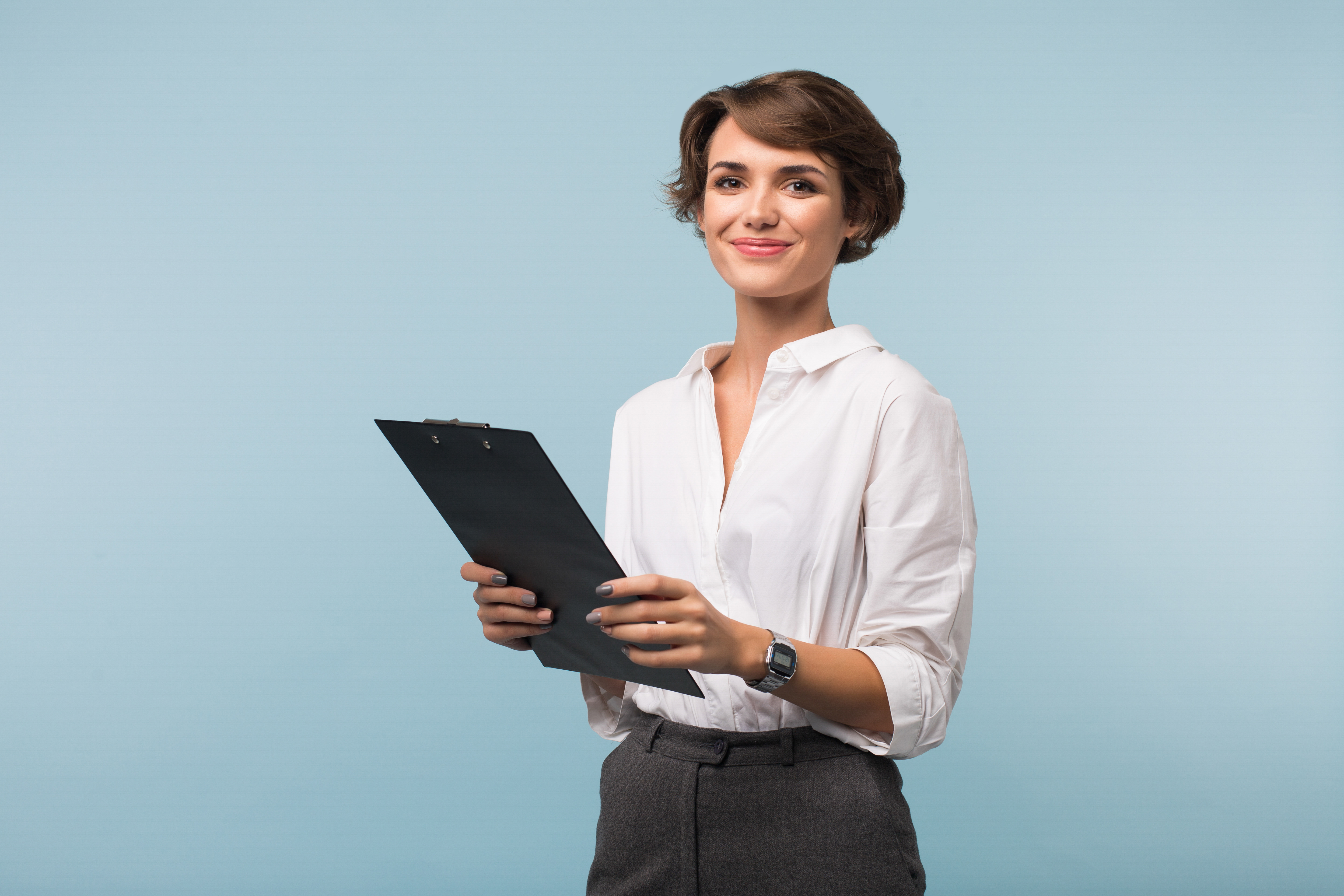 beautiful-business-woman-with-dark-short-hair-white-shirt-holding-black-folder-hands-while-joyfully-looking-camera-blue-background.jpg beautiful-business-woman-with-dark-short-hair-white-shirt-holding-black-folder-hands-while-joyfully-looking-camera-blue-background.jpg