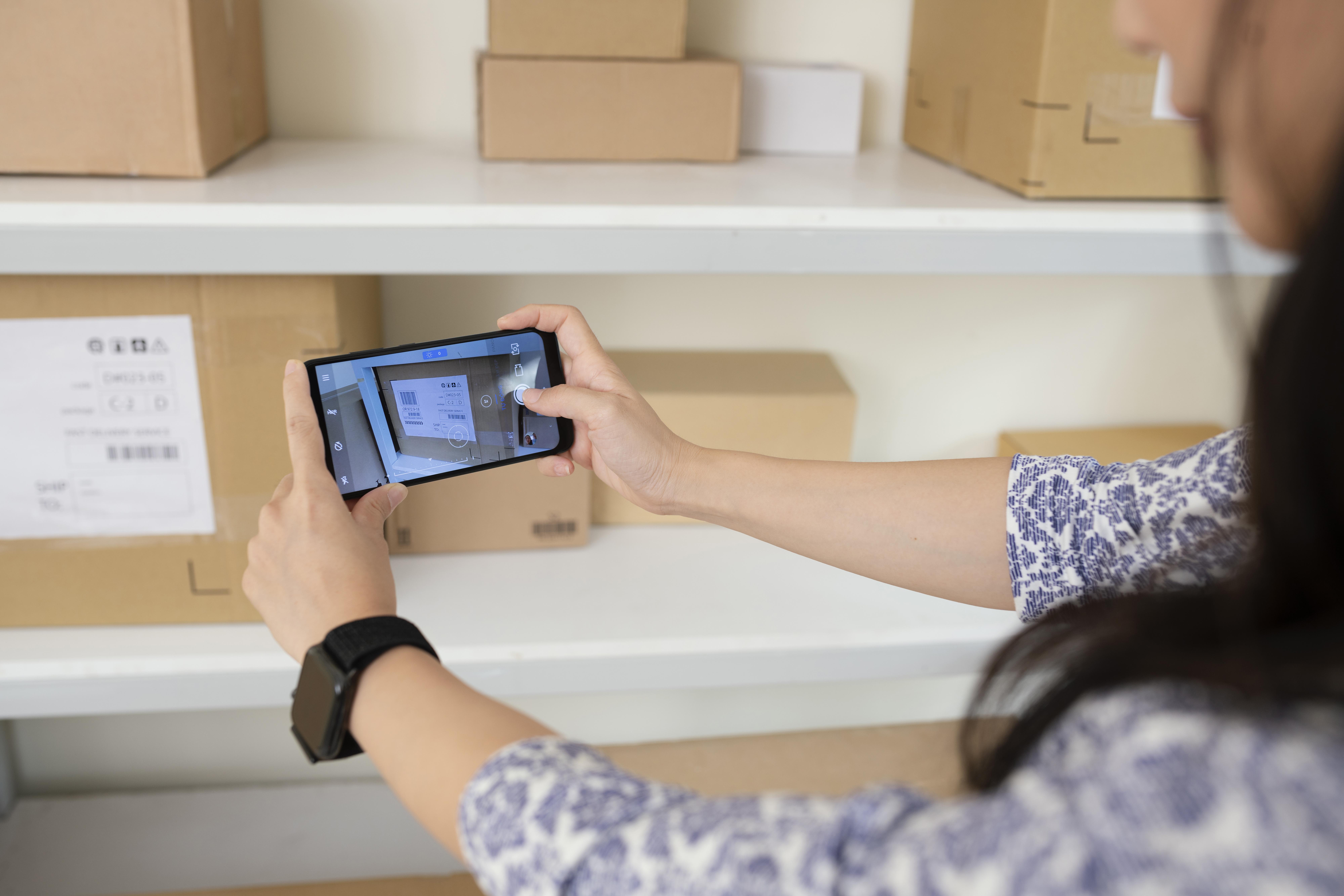 young-woman-taking-pictures-delivery-boxes.jpg young-woman-taking-pictures-delivery-boxes.jpg